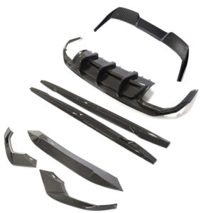 Carbon fiber car body kit parts laid out on white background: front splitter, side skirts, and rear diffuser components