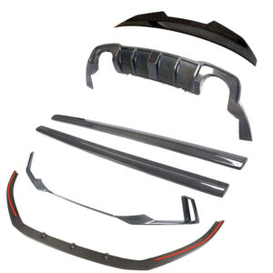 Carbon fiber car body kit components laid out: front splitter, side skirts, bumper lip and diffuser parts.