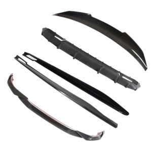 Set of carbon fiber car aero parts: front lip spoiler, side skirts/blades, rear diffuser pieces, and a curved rear spoiler.