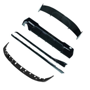 Disassembled black car bumper parts laid out on a white background, including curved bumper sections and trim pieces.