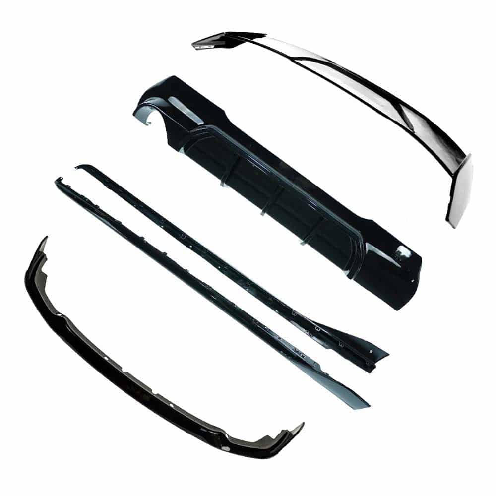 BMW-F40-1-SERIES-GLOSS-BLACK-SPOILER-MP-STYLE-7_3b06e50f-335e-4341-b36b-fc06c0129413jpg - OPSHOLDERS Disassembled black car bumper parts laid out on a white background, including the front bumper cover and related trim pieces.