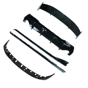 Black car bumper parts laid out on a white background, including curved bumper cover and supporting pieces.