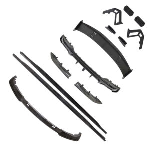 Exploded view of a carbon fiber car body kit with bumper pieces, side skirts, spoilers, and mounting brackets