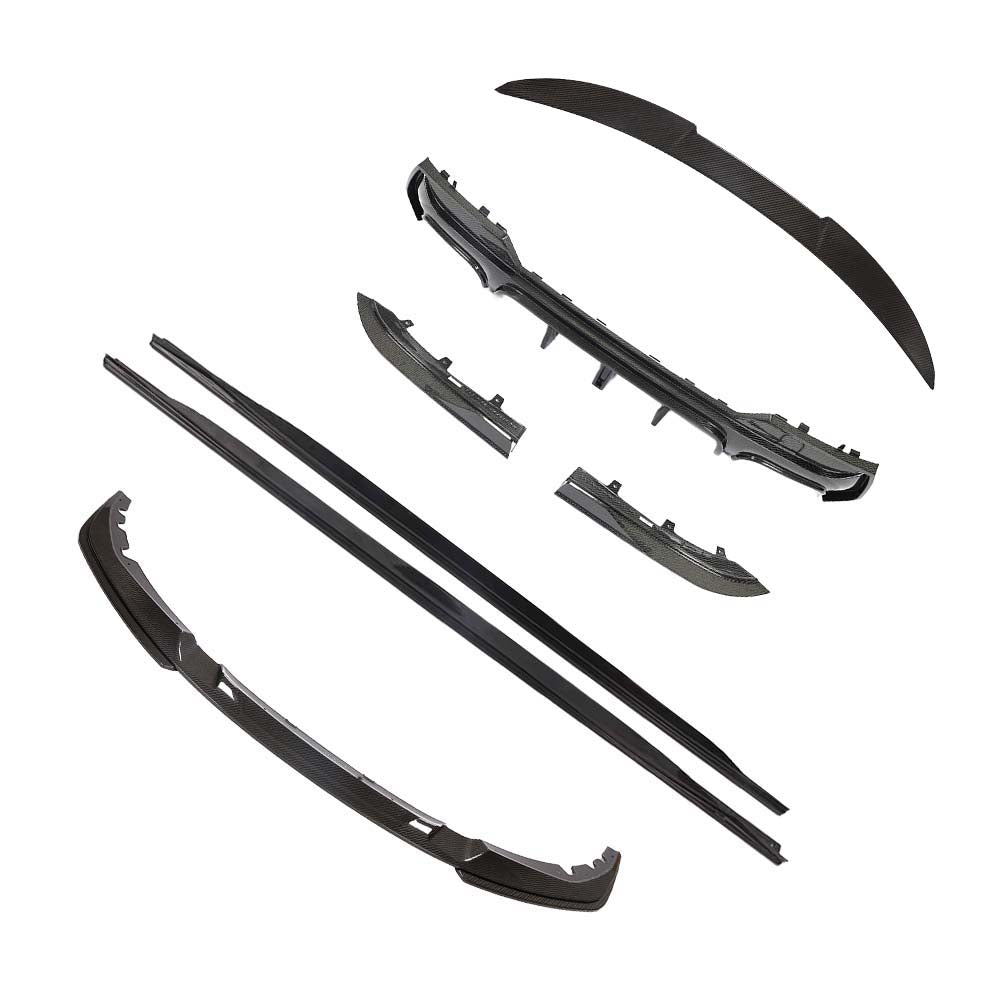 BMW-M44-SERIES-G82G22-PRE-PREG-CARBON-FIBRE-SPOILER-DA-STYLE-2_5113b71b-524a-46e6-9259-3566ba327d0ajpg - OPSHOLDERS Set of black car bumper lip and trim pieces laid out (unassembled), including front/rear lips and side sections, likely for a body kit.