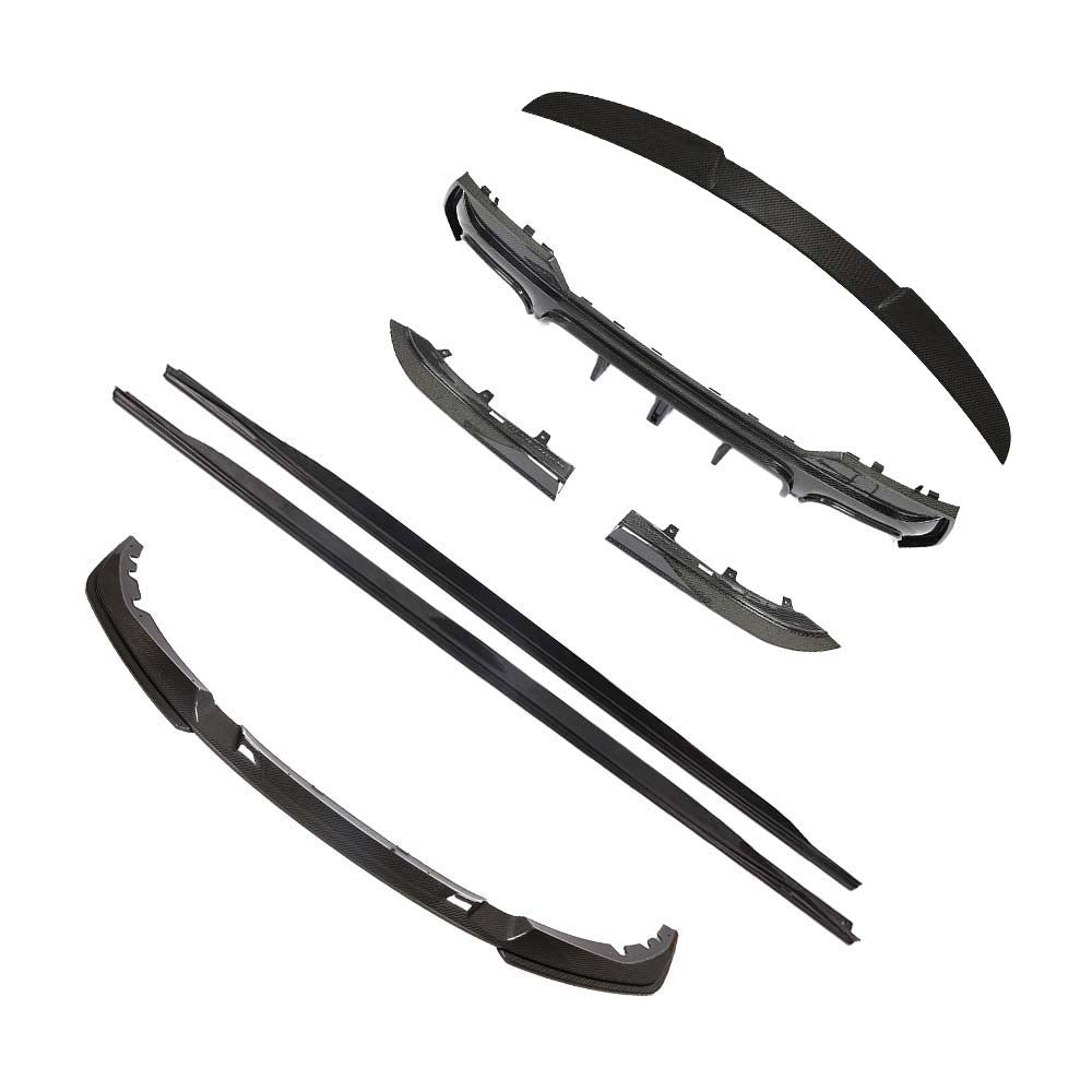 BMW-M44-SERIES-G82G22-PRE-PREG-CARBON-FIBRE-SPOILER-DA-STYLE-2_72d7d133-8e70-4bbf-a76c-542344449284jpg - OPSHOLDERS Scattered black car bumper components and trim pieces, including a front lip and side pieces, laid out separately.