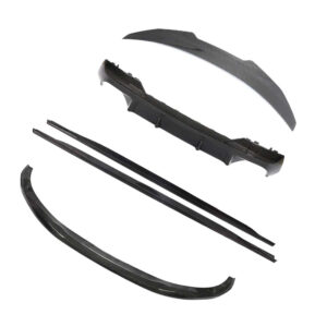 Set of carbon fiber car body kit components (spoiler, bumper lip, side skirts, and trim pieces) laid out together