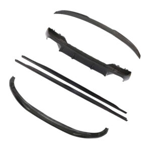 Set of carbon-fiber auto body parts laid out, including curved spoiler pieces and trim/diffuser components for a car.