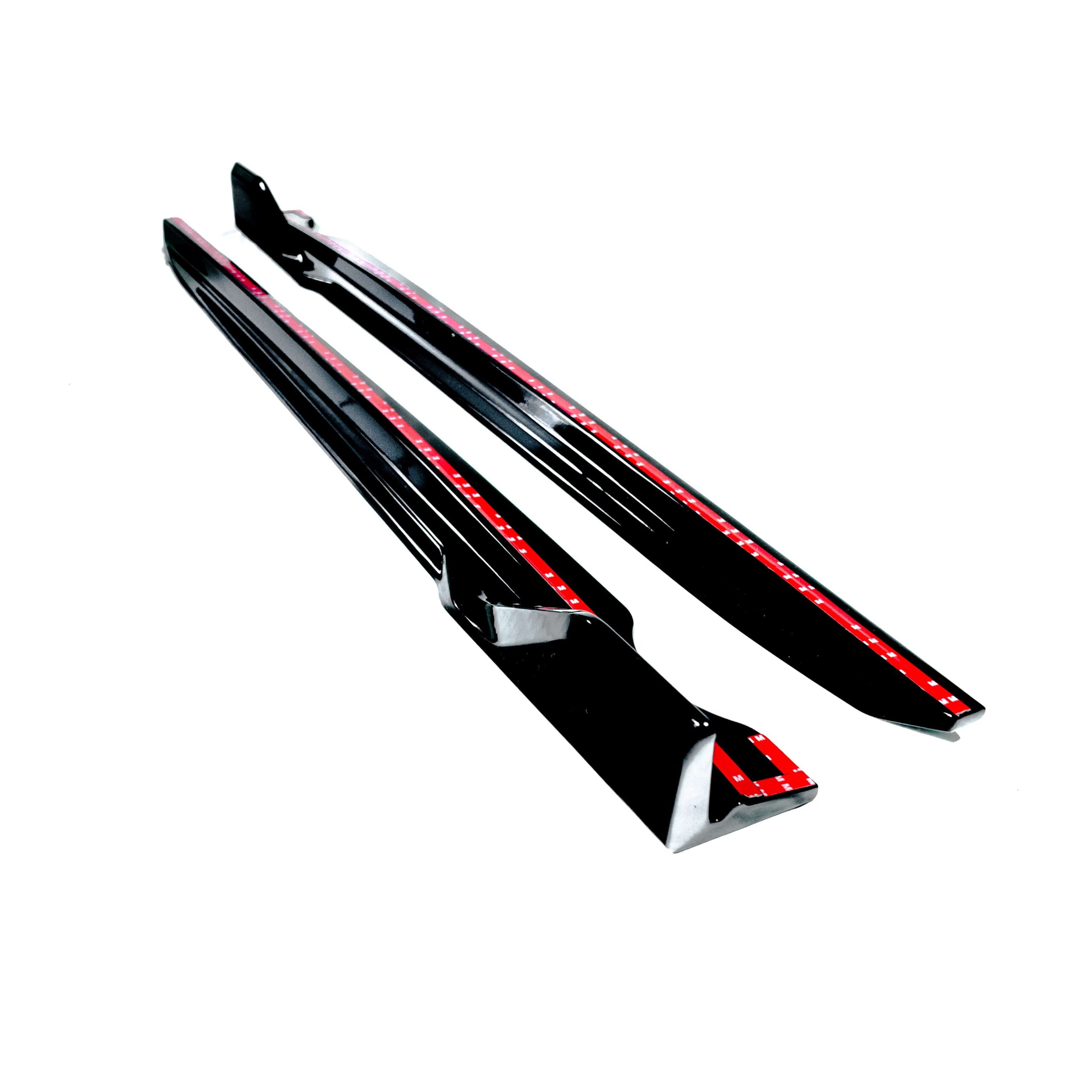 BMW-X5-G05-F95-X5M-GLOSS-BLACK-SIDE-SKIRTS-MP-STYLEjpg - OPSHOLDERS Pair of black skis with red dotted stripes, angled diagonally against a white background, showing bindings near the bottom edge.