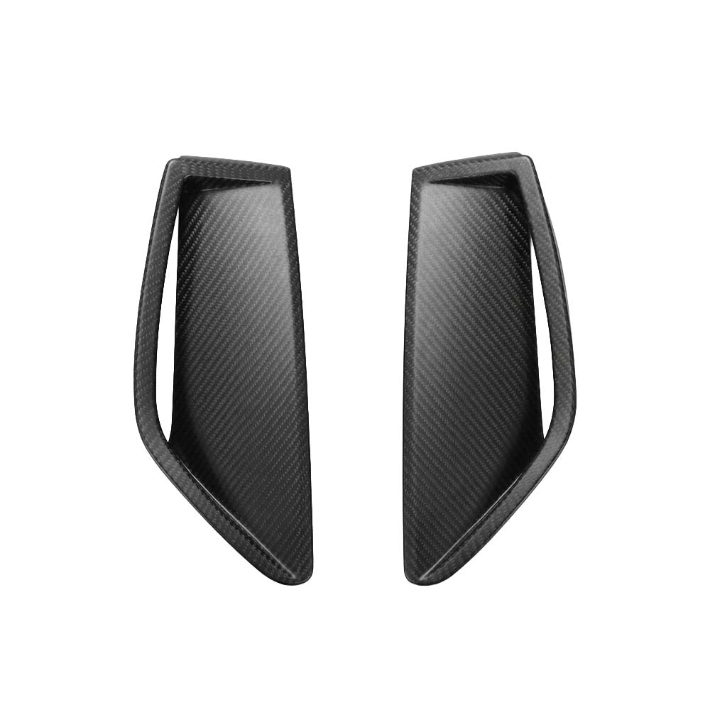 Bumperventsmattecarbonjpg - OPSHOLDERS Pair of black carbon-fiber fins with curved, wing-like shapes facing inward.