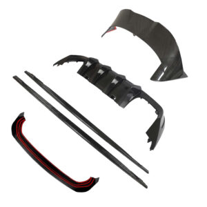 Carbon fiber car body kit parts laid out: front lip, side skirts, rear diffuser, and bumper pieces for a sports car exterior.