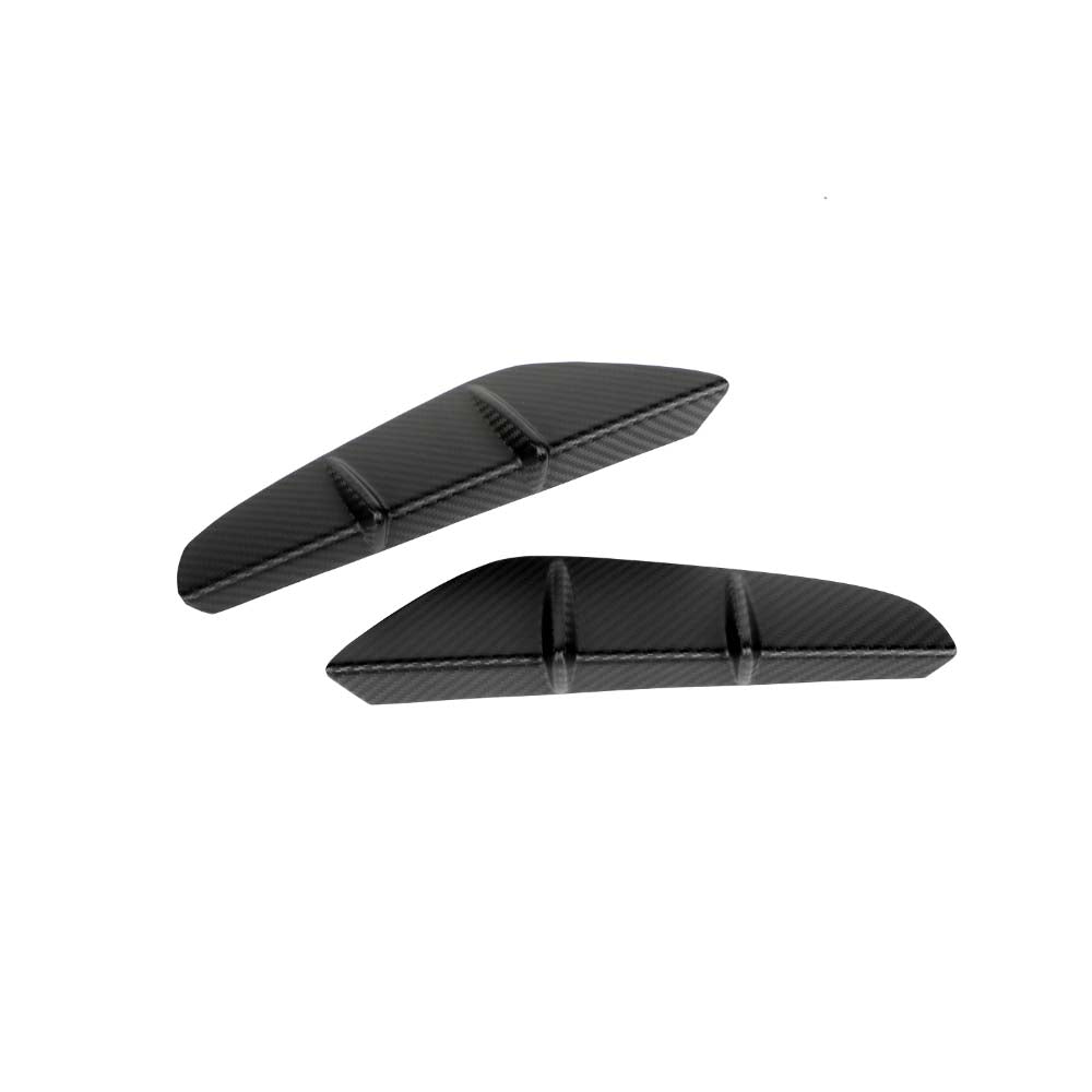 CT5353_5jpg - OPSHOLDERS Two black carbon-fiber–style wedge pieces with three raised ridges, positioned on a white background
