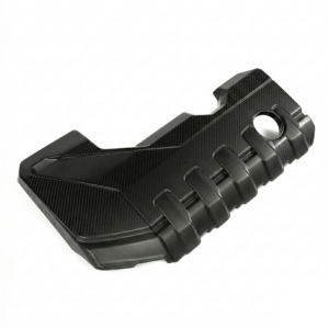 Black carbon-fiber textured plastic part with segmented ribs and a circular hole, likely a mounting or grip accessory.