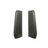 Pair of black carbon-fiber textured automotive trim pieces, curved elongated panels on a white background