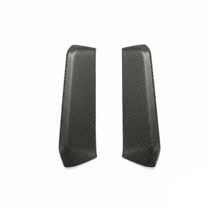 Pair of black carbon-fiber textured automotive trim pieces, curved elongated panels on a white background
