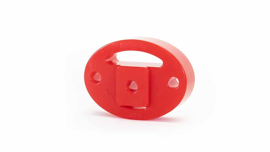 EXH045jpg - OPSHOLDERS Red circular plastic knob with a central square peg and two side holes, likely a small mechanical component or toy part