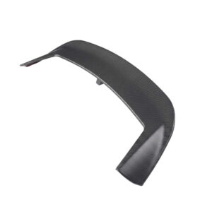 Curved carbon-fiber aerodynamic panel with a mounting tab, likely a vehicle winglet or spoiler component