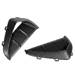 Two black carbon-fiber panels with mounting tabs, likely motorcycle fairing parts