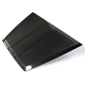 Folded black carbon-fiber tablet case acting as a stand, shown from a low angle