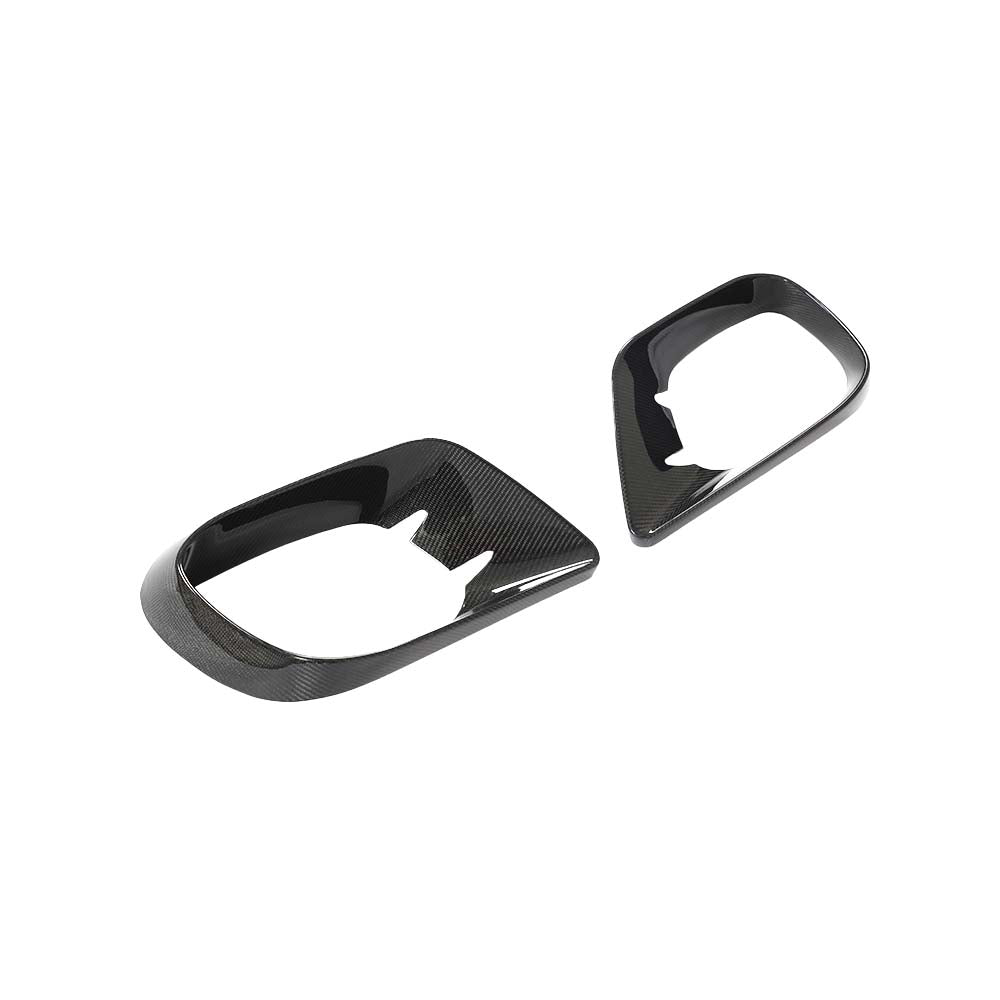IMG_7726_bd432ad1-3dda-4ac2-8784-9c4adbc0160djpg - OPSHOLDERS Two black carbon-fiber car interior trim pieces with oval openings (decorative bezels).