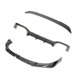 Carbon fiber automotive aero kit parts: front splitter, side skirts, and rear diffuser.