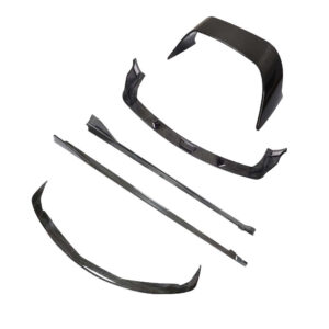 Carbon fiber car body kit pieces, including front splitter, side skirts, and rear diffuser, laid out on a white background.
