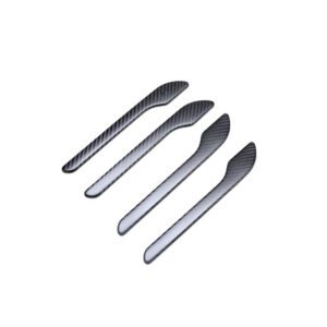Set of four carbon-fiber-look spreader tools arranged diagonally