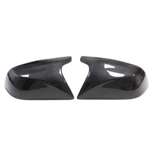 Pair of glossy carbon-fiber car mirror caps, left and right, shown separated