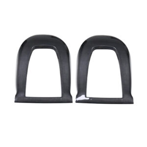 Pair of black carbon‑fiber style car interior trim pieces, rounded rectangular frames, one with minor chip at the lower edge on the right side.
