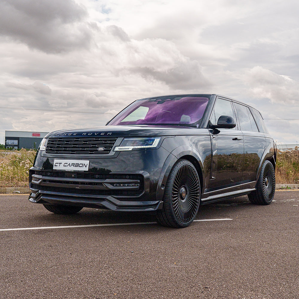 Range_Rover1x1_150725_CTCarbon_26_43e94a25-5cca-47df-a8e5-67a7658a8bbejpg - OPSHOLDERS Black Range Rover SUV parked on a lot, purple-tinted windshield, front grille and CT CARBON plate visible