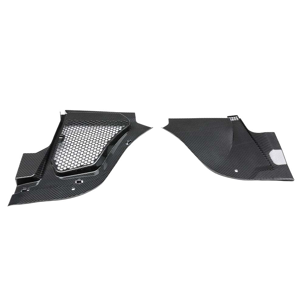WhatsAppImage2026-06-01at025246jpg - OPSHOLDERS Carbon fiber car body panel pair with a central mesh vent on the left piece and curved aerodynamic shapes on both pieces.