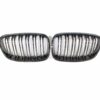 blak-by-ct-grille-bmw-f20-1-series-pre-lci-double-slat-black-grilles-blak-by-ct-carbon-ct-carbon-bmw-f20-1-series-pre-lci-double-slat-black-grills-28580363010218jpg - OPSHOLDERS Two black automotive grilles with vertical chrome slats placed side by side on a white background