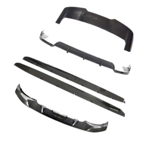Exploded view of a carbon fiber automotive body kit: front splitter, side skirts, underbody panels, and rear diffuser pieces laid out separately.