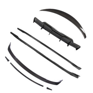 Disassembled black windshield wiper blades and adapters laid out on a white background (replacement kit)
