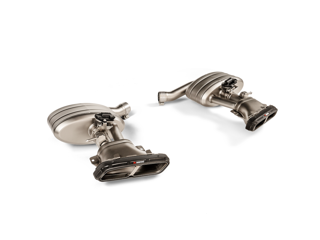 Akrapovic Mercedes-AMG C 63 S E PERFORMANCE (W206, S206) OPF/GPF Slip-On Line S-ME/T/18H - OPSHOLDERS Two stainless steel car exhaust mufflers with curved pipes on a black background