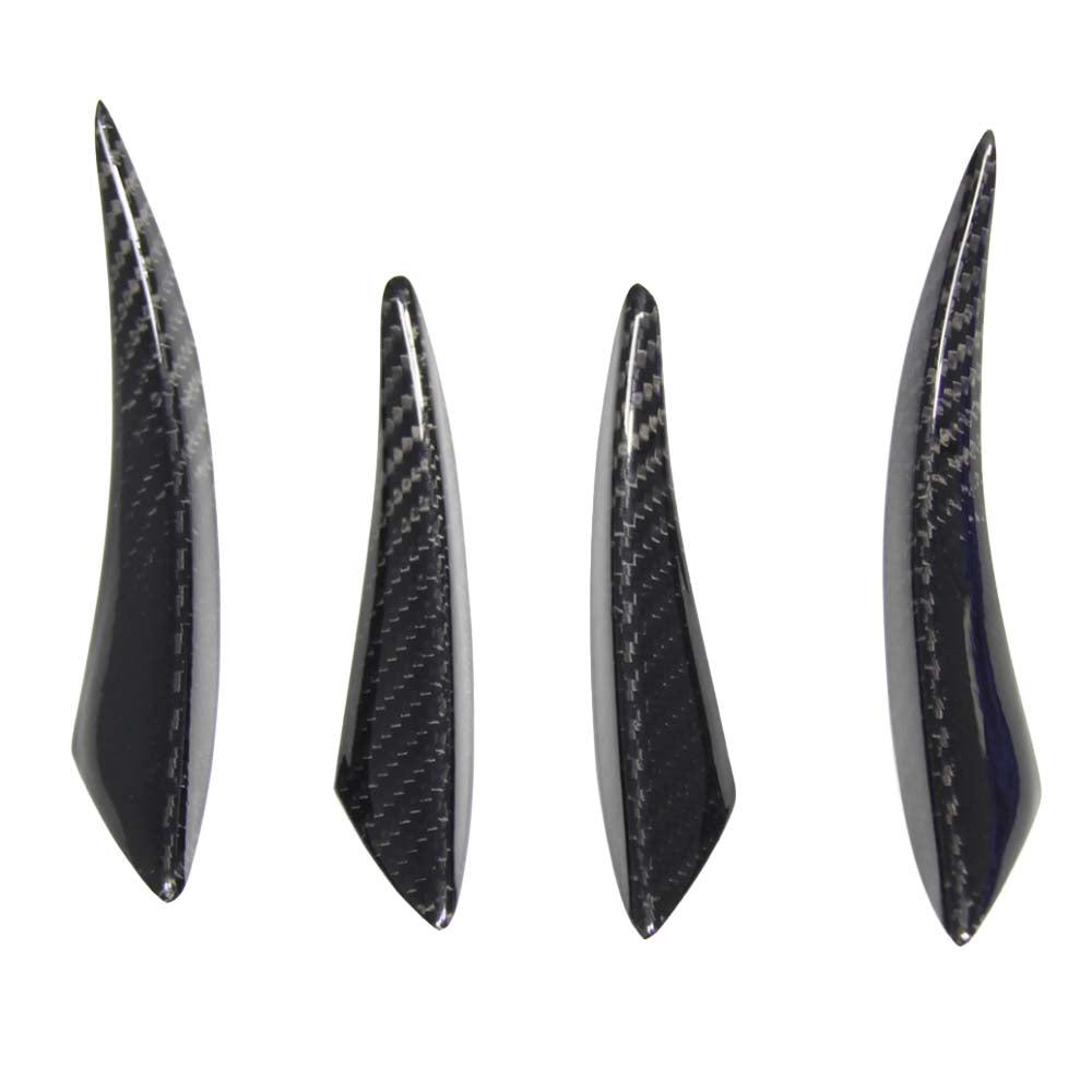 e304b8b33eb8003c06f1415a816e2777jpg - OPSHOLDERS Four black carbon-fiber-like fins of different lengths standing upright in a row on a white background.