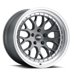 Chrome-finished alloy car wheel with a multi-spoke black spoke design and riveted lip detailing