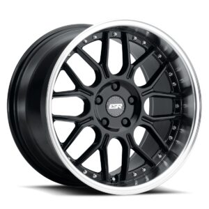 Black multi‑spoke alloy wheel with a polished outer lip and center cap logo