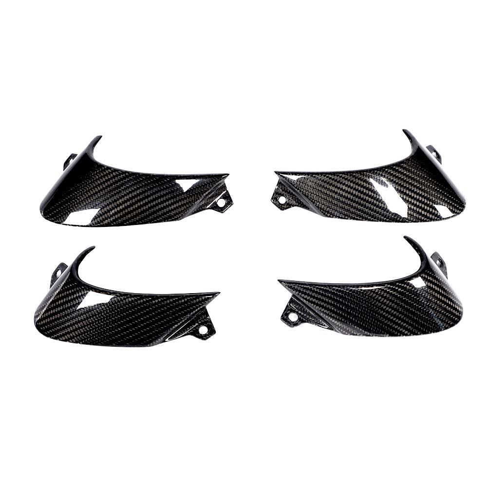 img_3_911f7d88-bea1-4cc1-a02f-cb06b8f6e20cjpg - OPSHOLDERS Set of four black carbon fiber car body panels with curved aerodynamic shapes, arranged in a quadrant view.