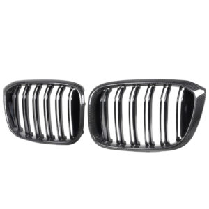 Pair of black carbon-fiber BMW kidney grilles with vertical slats shown side by side.
