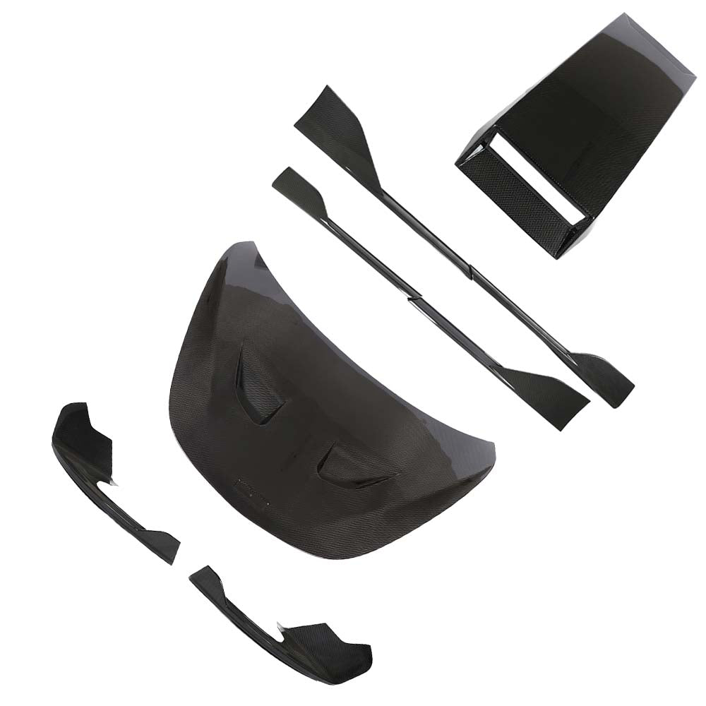 mclaren_570s_gt_carbon_fibre_corners_splitter_2_802623fb-d1ee-47c9-a876-99aa9a6ab27bjpg - OPSHOLDERS Carbon fiber automotive aero kit parts laid out, including a large curved front piece, end plates, and smaller wing components (splitter, diffusers).