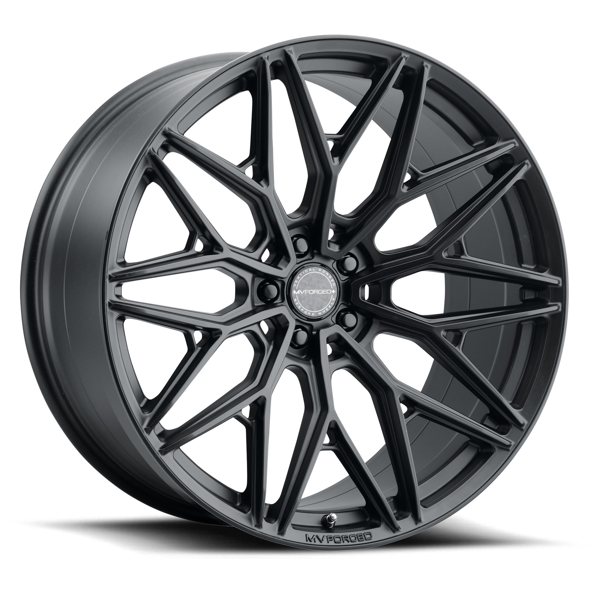 mvf2-satin-black-002_smtqt7wesymm12cnjpg - OPSHOLDERS Close-up of a matte-black MV Forged alloy car wheel with a complex spoke design and central cap marks MV Forged.