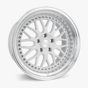 White alloy wheel with multiple spokes and a riveted outer lip, close-up view. 4/4 inches visible detail of bolts around the rim?