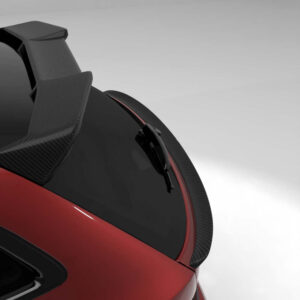 Close-up of a red sports car’s rear window area with a black wiper and carbon-fiber spoiler against a gray background.