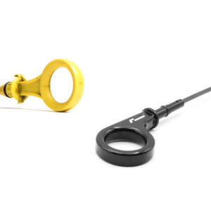10-14-tsi-billet-dipstick_53399886368_o-scaled-1jpg - OPSHOLDERS Close-up of a yellow ring-shaped medical device attached to a black stethoscope on a white background.