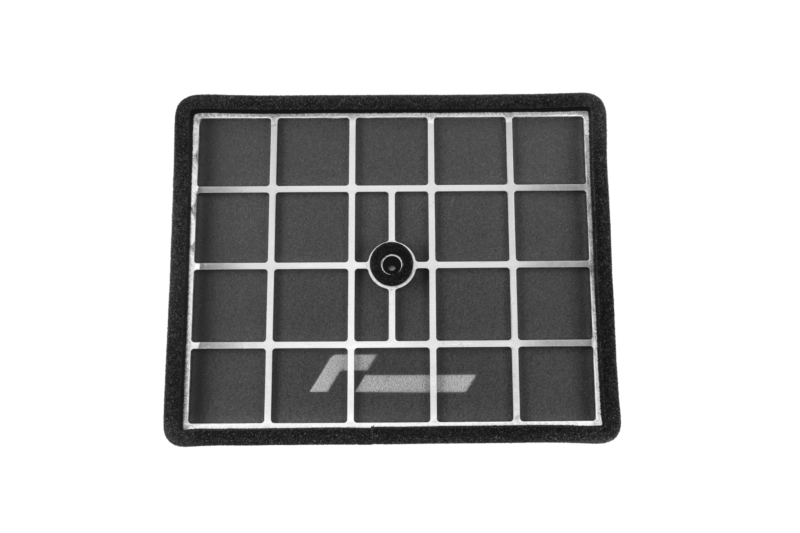 Close-up of a solar panel grid with dark rectangular cells and a central mounting hole in the frame.