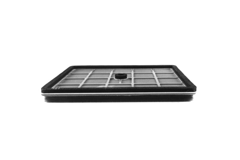 Close-up of a square air filter with a black frame and grid pattern