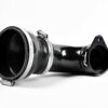 10-tsi-turbo-inlet-elbow_49608404033_o-scaled-2jpg - OPSHOLDERS Close-up of a black camera lens barrel with metal clamps and a mounting flange on a white background.