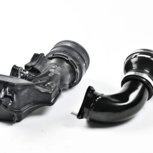 Disassembled turbocharger parts on a white background: compressor and turbine housings visible on black metal components
