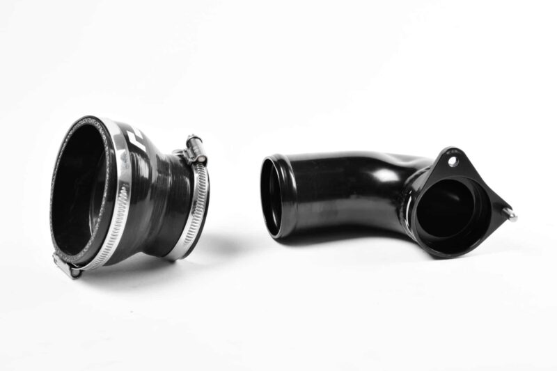 Two black camera lenses on a white background, one with a silver mounting ring to the left.