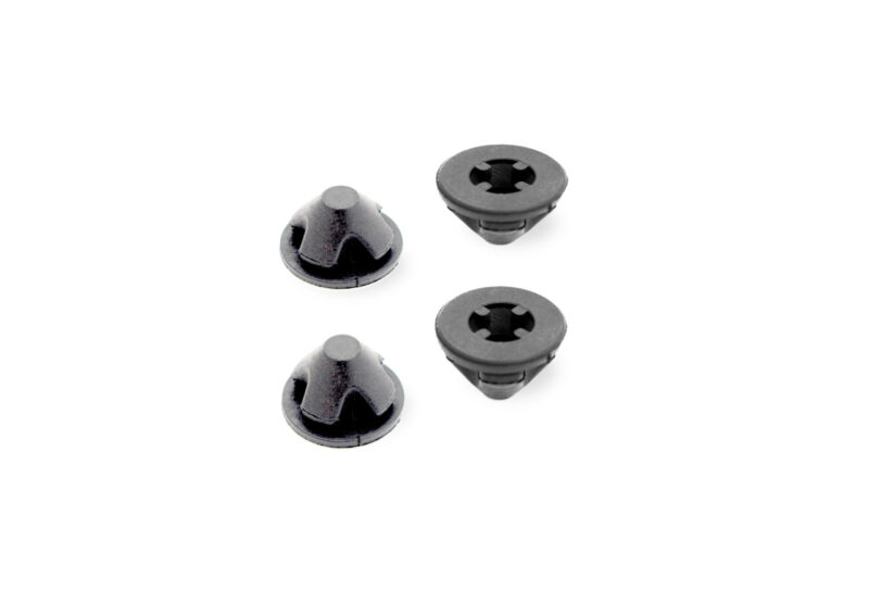 25-tfsi-engine-cover-grommets_53352784783_o-scaled-1jpg - OPSHOLDERS Small cluster of black rubber screw-in caps with conical tops and a central cross-shaped socket, on a white background
